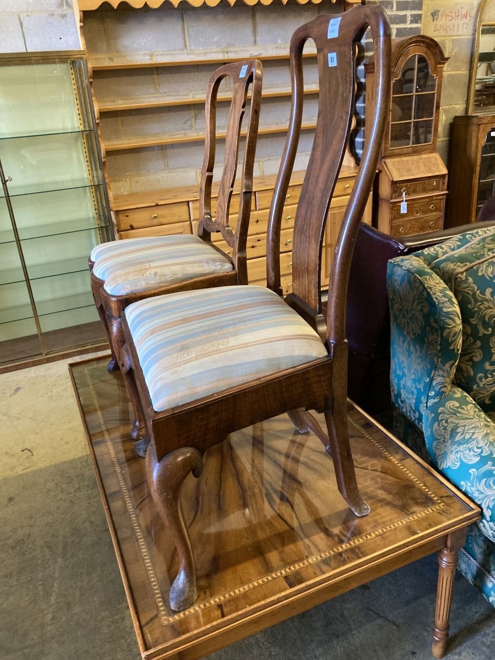 Two early 18th century walnut dining chairs